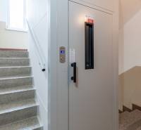 A staircase with a modern elevator in a 3-room apartment on G. Bethlen Street in Nové Zámky.