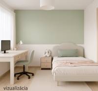 A bright room in a family house with a bed, a table, a green wall, and a wooden-patterned floor.