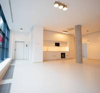 Spacious kitchen in a 4-room apartment with large windows and light flooring.