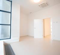 A bright room in a 4-room apartment with high windows and air conditioning.