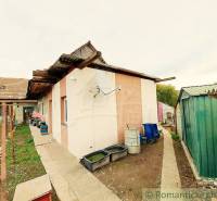 The courtyard of a family house in Ľudovítová with a shelter and outdoor equipment.