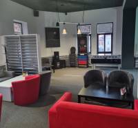 Interior of commercial premises with seating, table football, and darts.