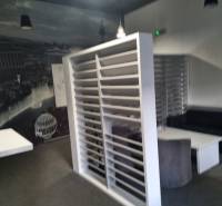 Interior with separate spaces and black-and-white wall decoration. Commercial premises.