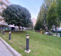 A building surrounded by greenery with balconies on Prešovská Street in Bratislava - Ružinov.