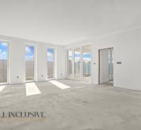 A bright spacious room in a family house with large windows and a view.