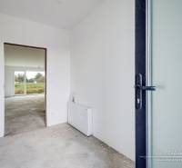 Interior of a family house with a bright room and a view of the garden.