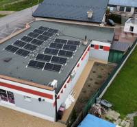 A building with solar panels on the roof at Štefánikova 267 in Palárikovo.