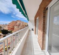 Balcony of a 3-bedroom apartment on Calle Arrecife t, Punta Prima with a street view.