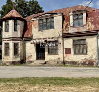 An older family house in Jasenie needs renovation, with a turret and a worn-out roof.