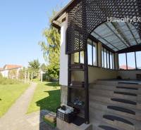 A family house in Hegyeshalom with a terrace and a landscaped garden.