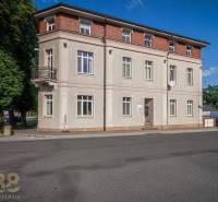 A building on Halatova Street in Poprad with a balcony and large windows.