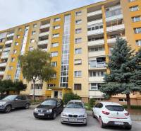 Apartment building on Exnárova Street in Prešov, with parked cars in front of it.