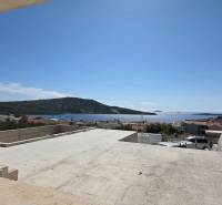View from the terrace to the sea in Primošten, overlooking the rooftops and landscape.
