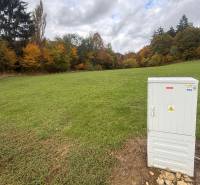 A woman on a plot of land with grass and trees in Zbor, Púchov - Land, housing.
