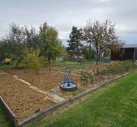 Gardens on A. Hlinka Street in Zvolen with plantings and a gazebo.