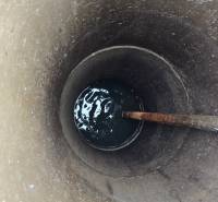 A view into the well with a water surface in the Gardens in the city of Zvolen on A. Hlinka Street.