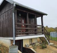 Wooden garden cottage in the Gardens on A. Hlinka in Zvolen, with a metal roof.