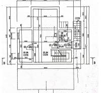 Basement floor plan of a family house with utility rooms and staircase.