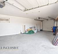 A garage with a concrete floor and various tools, commercial premises.