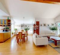 Open living space with wood-patterned flooring in a family house.