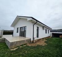 A family house on Veterná Street in Sokolovce with a terrace surrounded by a lawn.