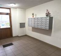 The entrance hall of an apartment building on Trenčianska Street in Nová Dubnica, with mailboxes.