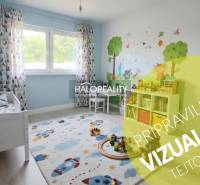 Children's room in a family house with a play carpet and wall decorations.