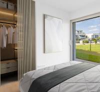 A bedroom with a view and a built-in wardrobe in a 4-room apartment.