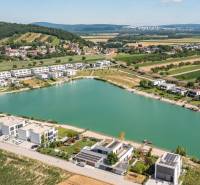 Aerial view of a residential area by the lake in Kittsee, Am Strandbad, 4-room apartments.