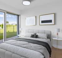 A bedroom with a large window and a wooden decor floor in a 4-room apartment.