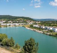 Lake surrounded by modern houses on Am Seepark street, Kittsee.