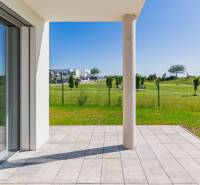 Terrace of a 4-room apartment in Kittsee, Am Seepark with a view of the green park.