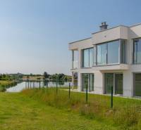 Luxury house by the lake on Am Seepark street in Kittsee. Elegant glass surfaces.