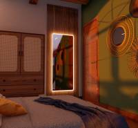 Bedroom in a studio apartment with cozy lighting, a mirror, and wall decor.