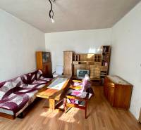 Living room in a family house with furniture and flooring with a wood decor.