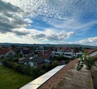 View of the residential area Bratislava - Vajnory with a vast sky and rooftops of houses.