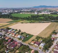 Aerial view of Práznovce, Land - residential areas near agricultural landscape.
