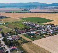 Aerial view of extensive residential plots in Práznovce with surrounding fields.