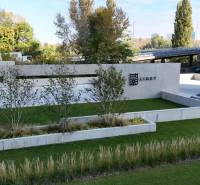 Parking lot with cars and greenery on Krasovského Street in Petržalka.