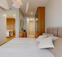 Bedroom in a 4-room apartment with a bed, wardrobe, and wooden floor decor.