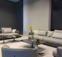 Gray sofas with coffee tables decorated with flowers in a 4-room apartment.