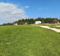 Residential plots in Stránske on Stránske Street with a view of houses and greenery.