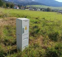 Plots - housing in Stránske on Stránska with an electrical cabinet, mountain panorama in the background.