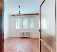 A room in a 3-room apartment with a wood-patterned floor and a window with blinds.