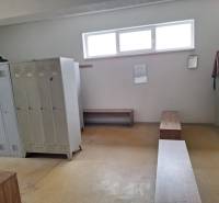 Locker room with lockers and benches in warehouses and halls, simple interior.