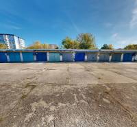 Garages on Akademika Jozefa Čabelku Street in Holíč with a view of greenery and buildings.