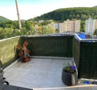 A balcony with a view of Trenčianske Teplice, buildings and greenery, Trenčianske Teplice, 2-room apartment.