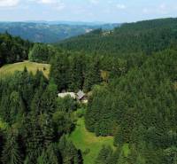 Wooded areas and meadows around Vysoká nad Kysucou, surrounded by agricultural and forest lands.