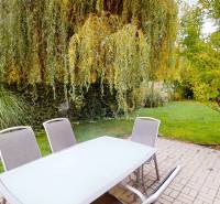 The terrace of a family house on Lotosova Street in Malinovo with outdoor seating and greenery.