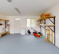 Garage with shelves, tools, and equipment in a family house.